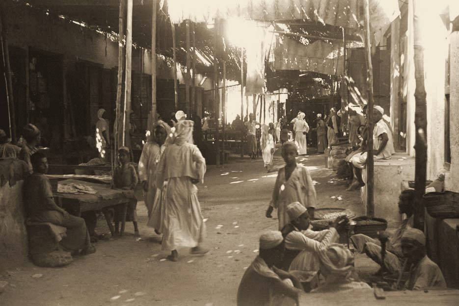 Shoppers and traders in the covered souq, Dubai, 1948